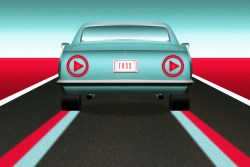 A car with play button taillights driving down a road