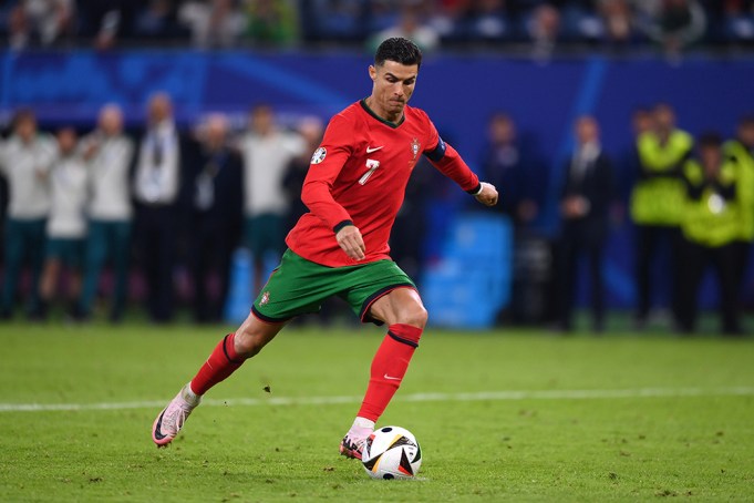 HAMBURG, GERMANY - JULY 05: Cristiano Ronaldo of Portugal takes a penalty in the shoot out during the UEFA EURO 2024 quarter-final match between Portugal and France at Volksparkstadion on July 05, 2024 in Hamburg, Germany. (Photo by Justin Setterfield/Getty Images)