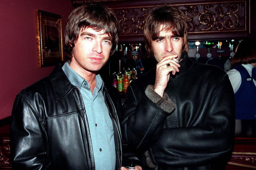 LONDON - 1995: Oasis lead singer Liam Gallagher and brother Noel Gallagher at the opening night of Steve Coogan's comedy show in the West End, London. (Photo by Dave Hogan/Getty Images)